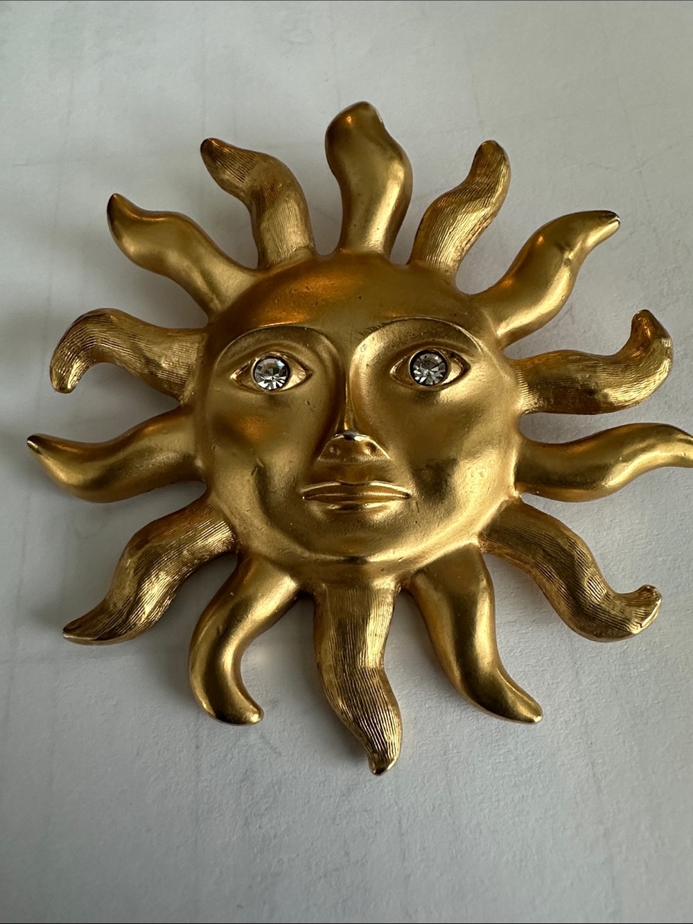 Avon vintage Gold Sun Face Brooch with Crystal Accent-wear & tear on the front.